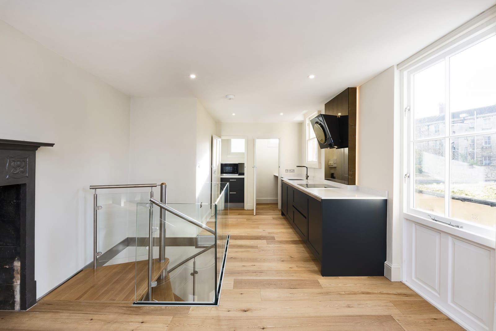 Beautiful Spiral Staircases in stainless steel with oak and curved perspex