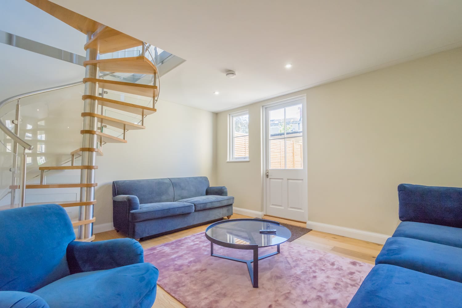 Beautiful Spiral Staircases in stainless steel with oak and curved perspex